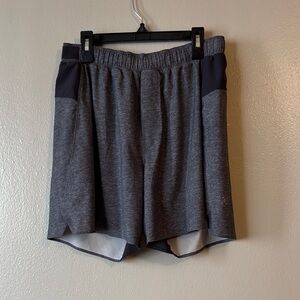Lululemon Surge Short 5.5” Lined shorts in a heathered grey color Size M